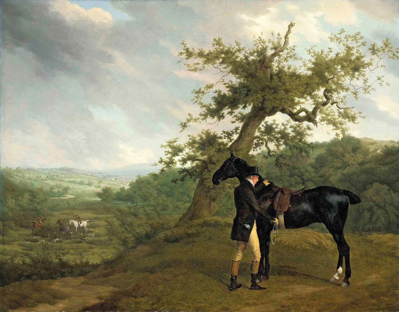 irving with his black hunter beneath a blasted oak and hounds being put into a covert beyond